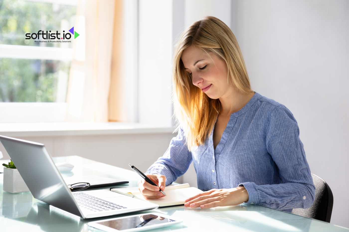 a woman writing on her table