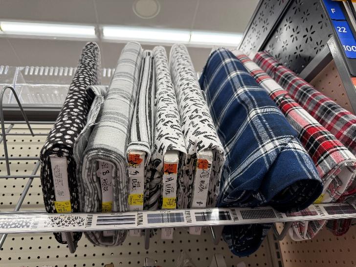 A shelf with fabric on it

AI-generated content may be incorrect.