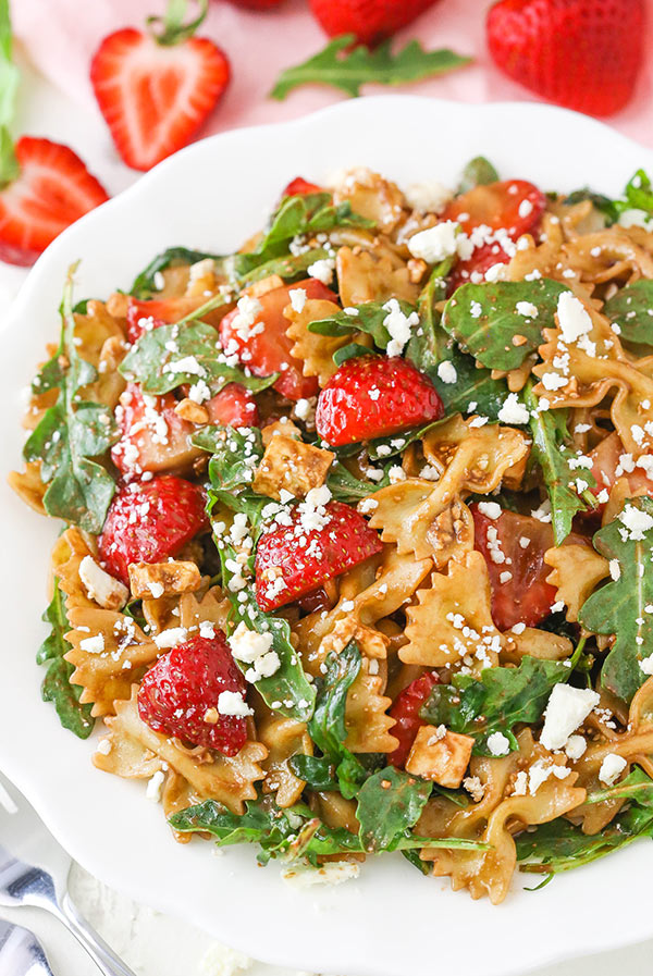 Strawberry Feta balsamic pasta salad in a white serving bowl