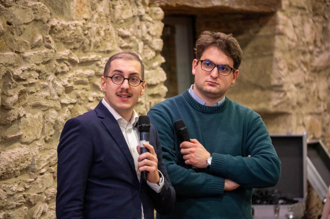 Two men standing next to each other

AI-generated content may be incorrect.