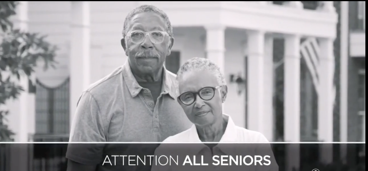 An older couple stares into the camera with concerned looks on their faces, while text ATTENTION ALL SENIORS rushes across the screen