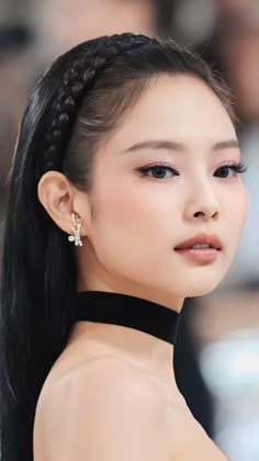 This contains an image of jennie looking side way