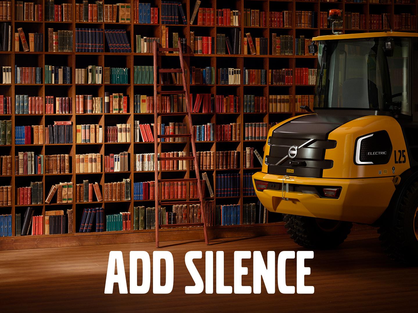 A yellow truck in front of a bookshelf Description automatically generated