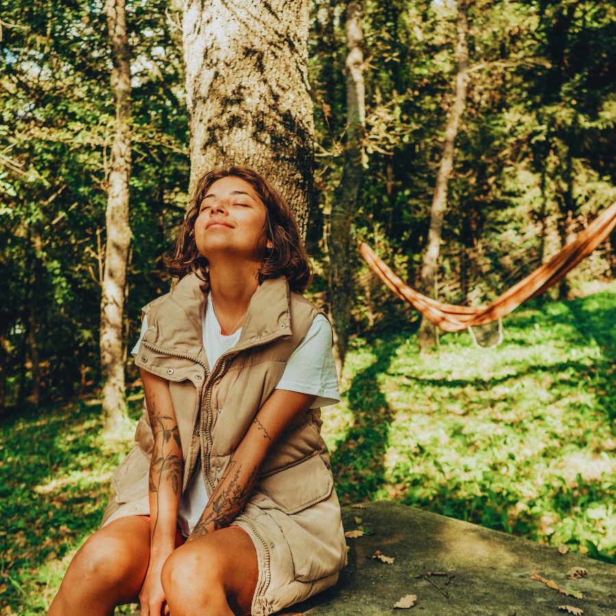 camping woman enjoying the sun