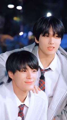 This contains an image of Jeno and Jisung wearing ties and white shirts posing for the camera with their arms around each other