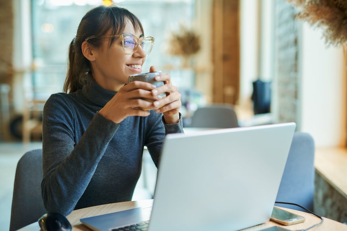 Employee drinking a cup of coffee