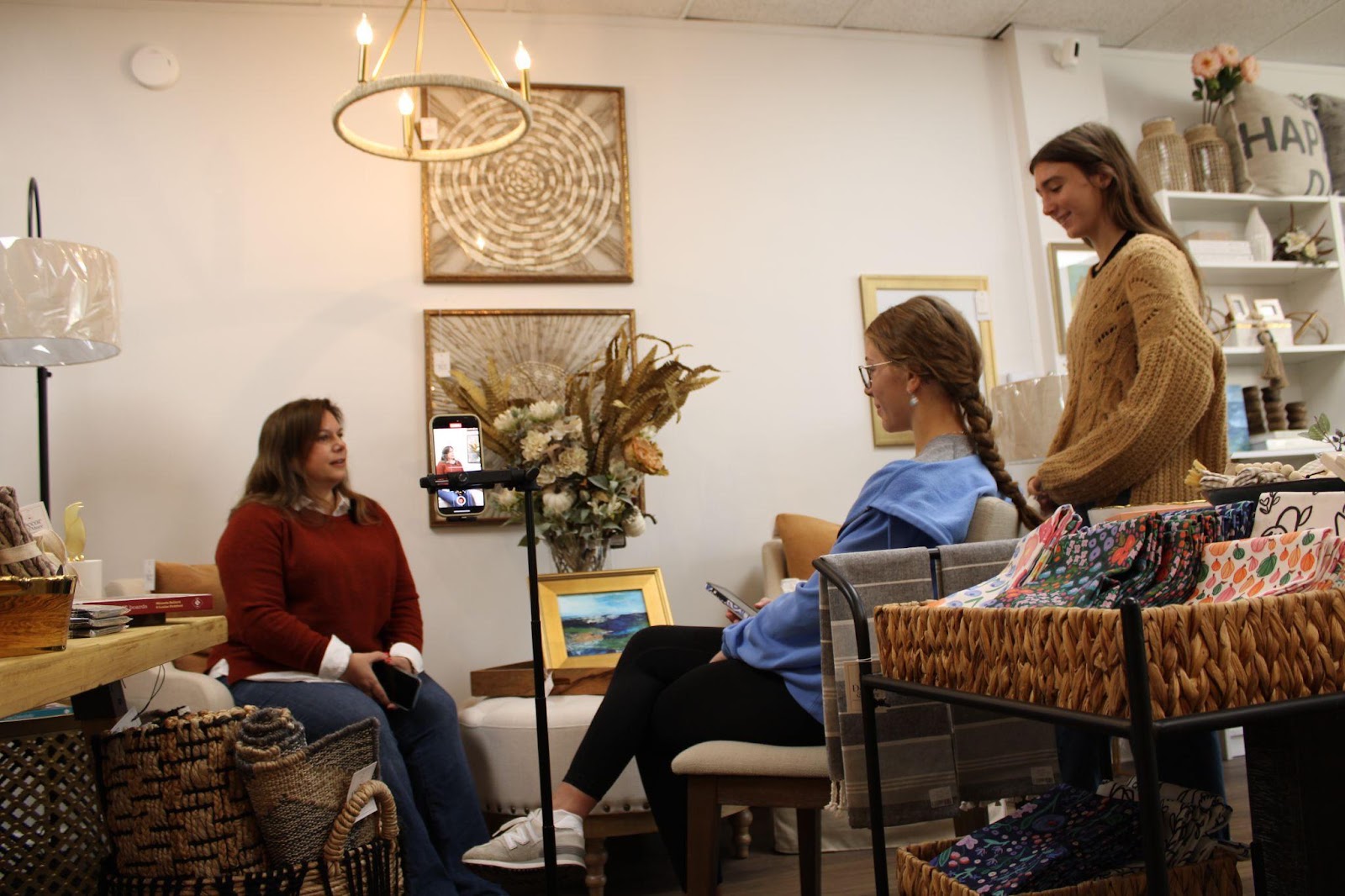  Caz Life student interns interview store owner Michelle O’Connor of Decor & More.