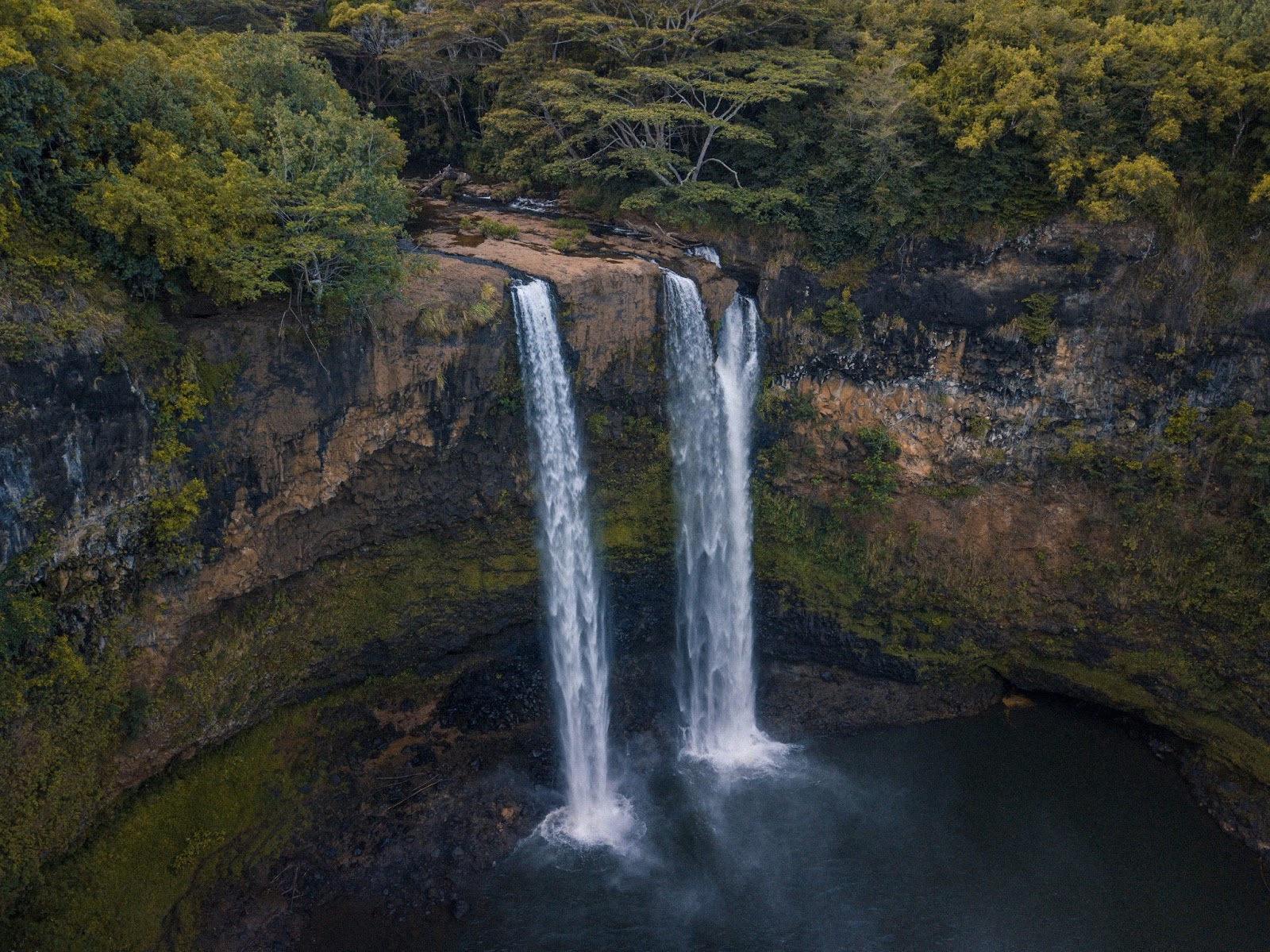 Kaua‘i’s lush towering waterfalls, and hidden beaches.