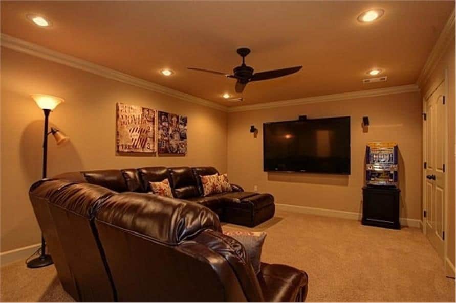 The media room includes a wall-mounted TV and a snack bar.