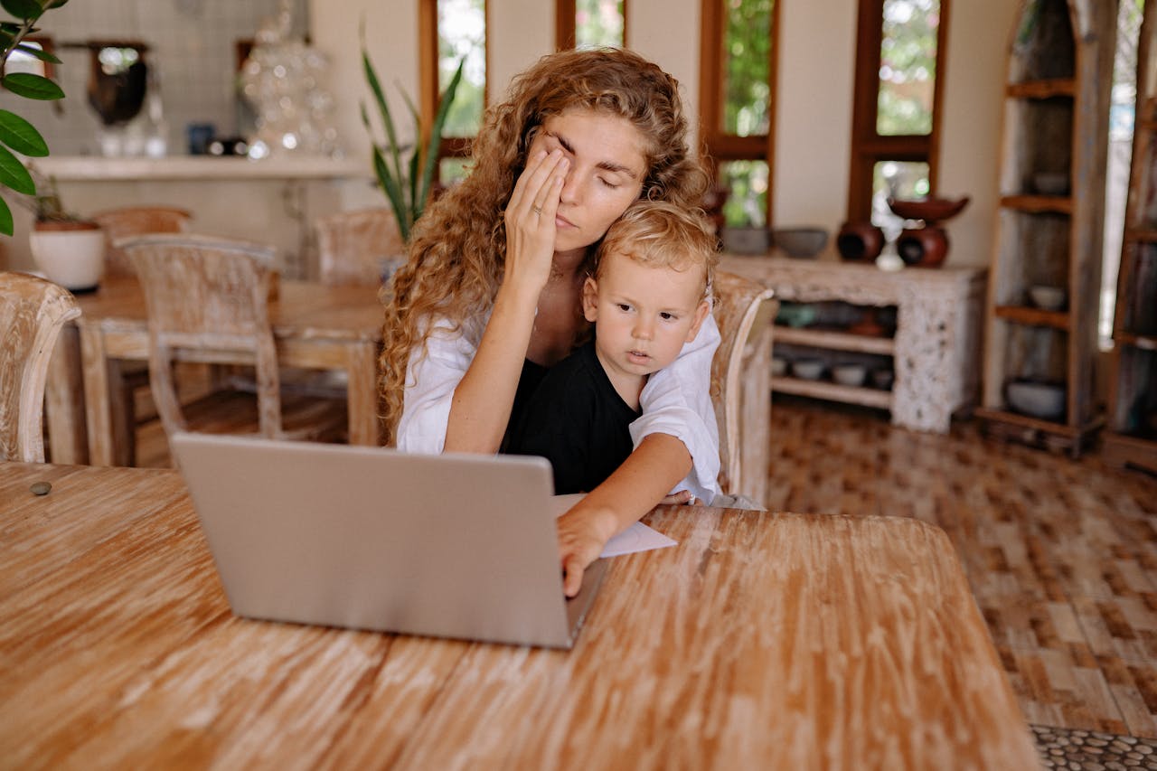 A Mother Using Laptop with her Son // Healthier Baby Today