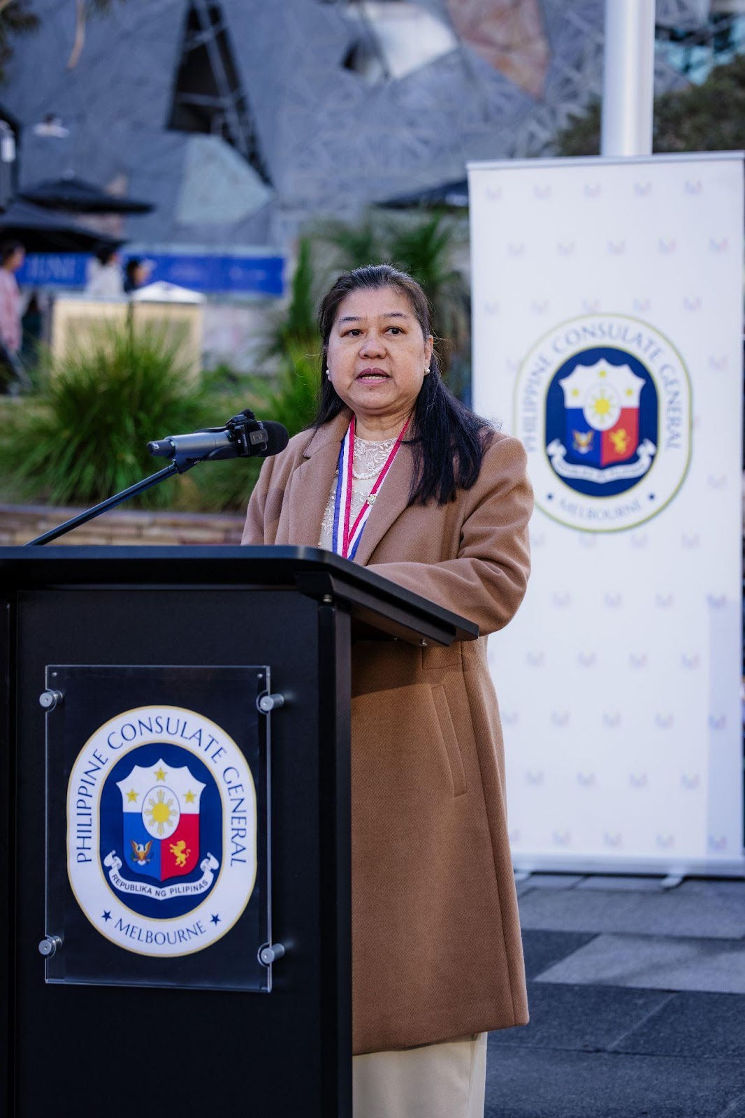 A person standing at a podiumDescription automatically generated