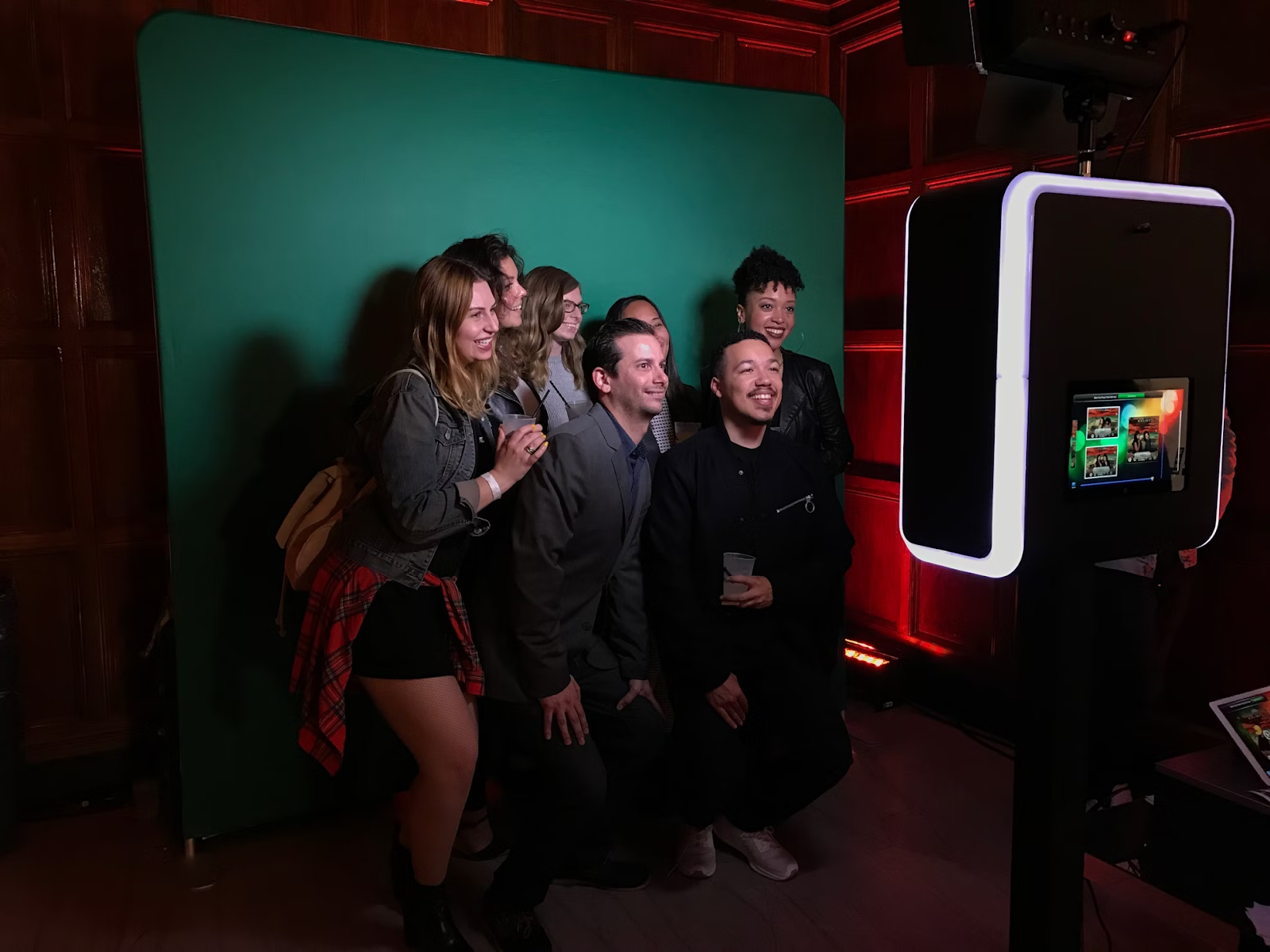 https://unsplash.com/photos/a-group-of-people-standing-in-front-of-a-green-screen-YN5e3vH45DY 