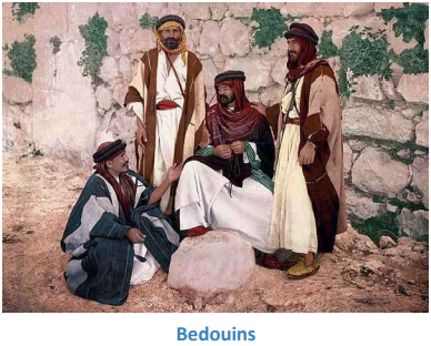 A group of men sitting on a rock

Description automatically generated with low confidence