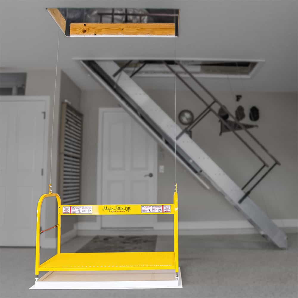 Majic Attic Lift platform lowered on garage floor