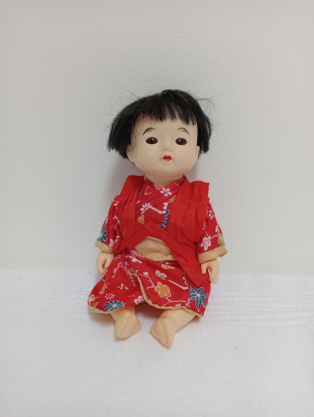 A Japanese doll in a wedding kimono