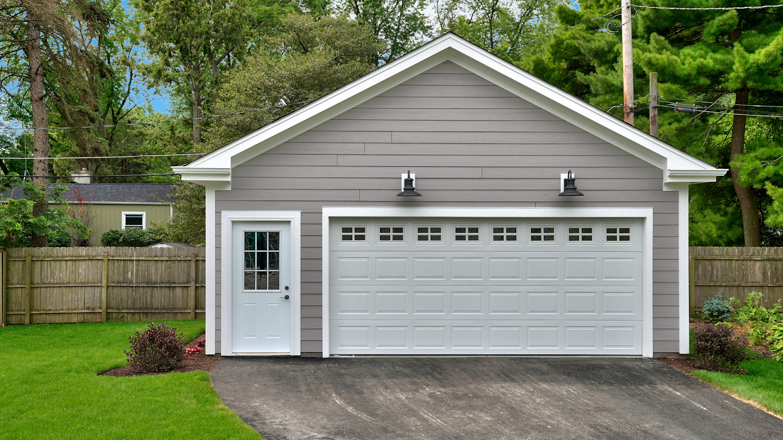 A garage with steel garage door and windows