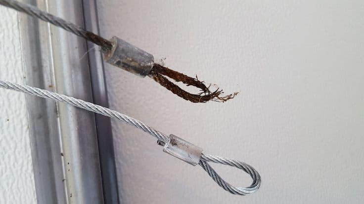 how to repair garage door cable