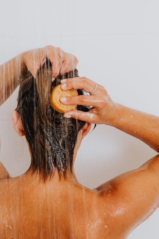 A lady washing her hair
