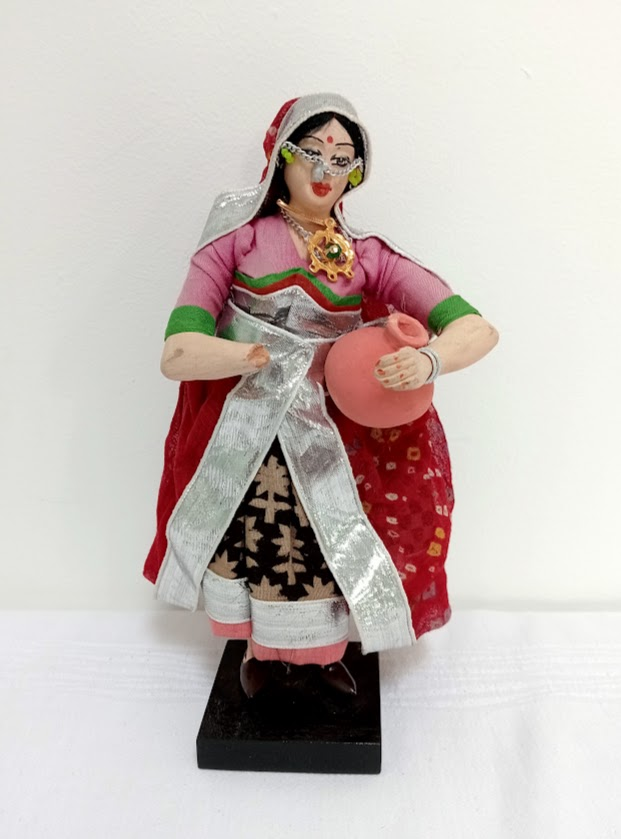A Rajasthani woman holding a matka