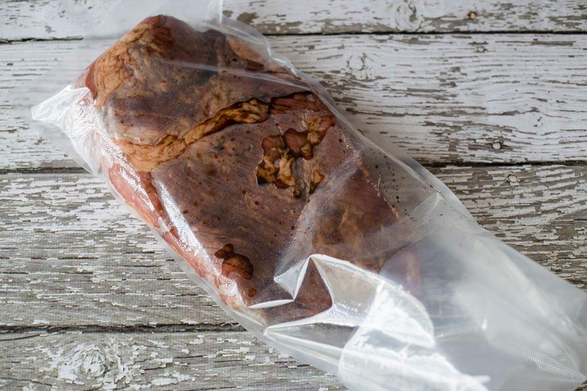 Beef brisket in an 11 inch vacuum sealer roll bag