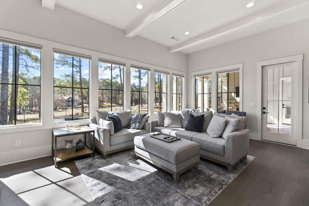 A wall of windows floods the keeping room with natural light.