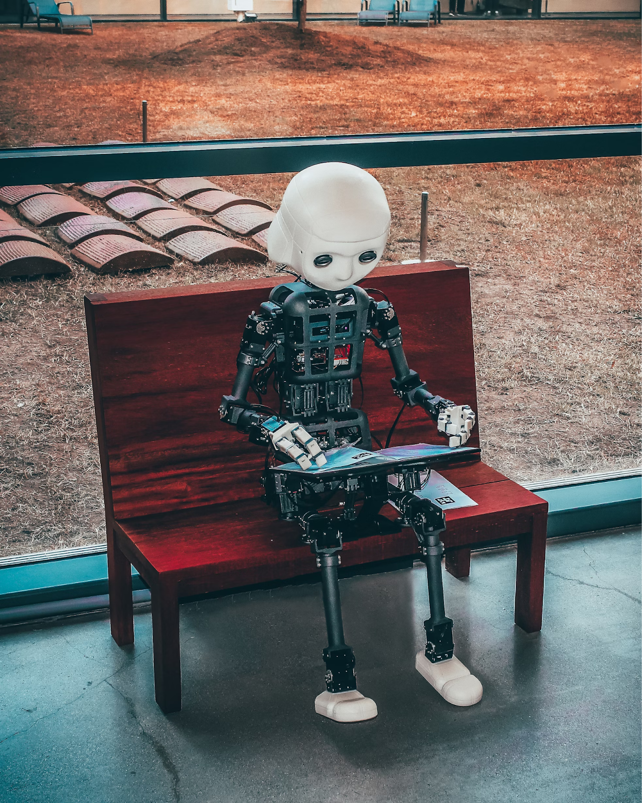 A robot sitting on a bench