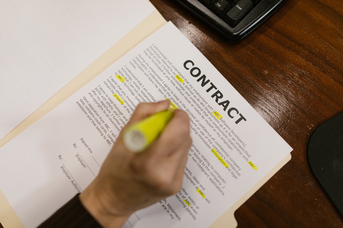 a person highlighting some parts in a contract