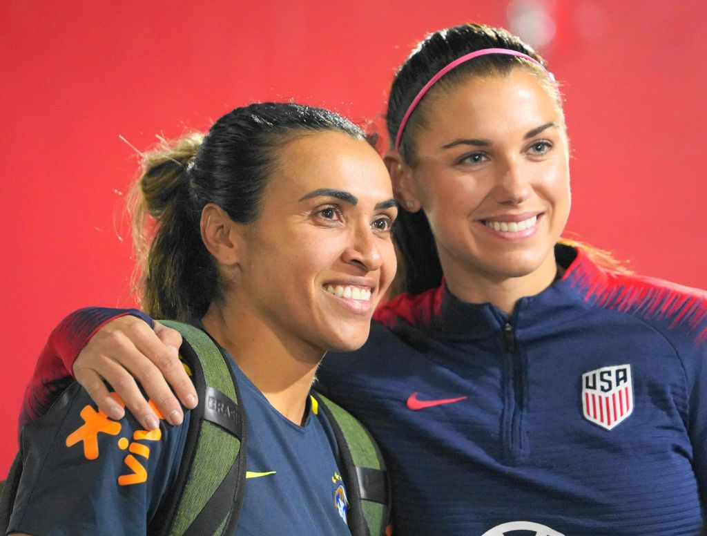 Alex Morgan posing with Marta of Brazil