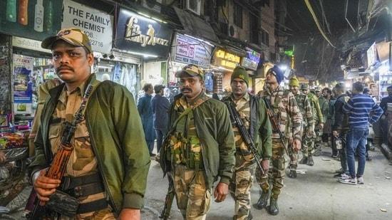 Police personnel patrol Jama Masjid area on the eve of the Delhi assembly elections, in New Delhi, on Tuesday. (PTI)