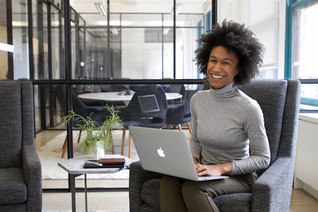 A startup founder working on a laptop symbolizing the process of choosing the best cloud hosting provider for business success