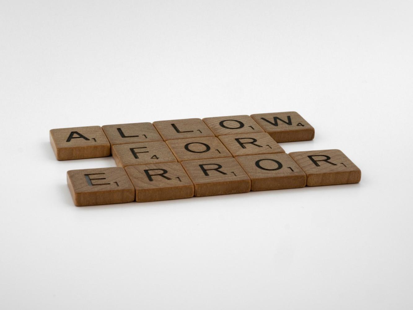 A close-up of a scrabble tile

Description automatically generated