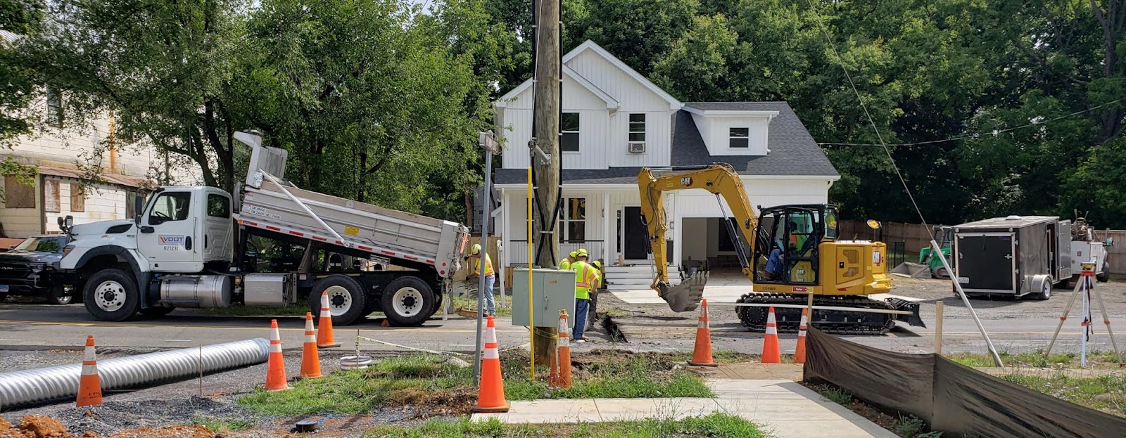 Construction workers working on a houseDescription automatically generated