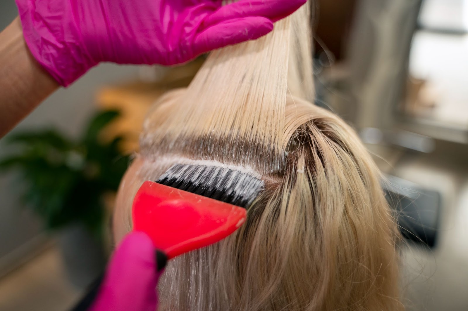 A woman getting her uneven hair color treated.