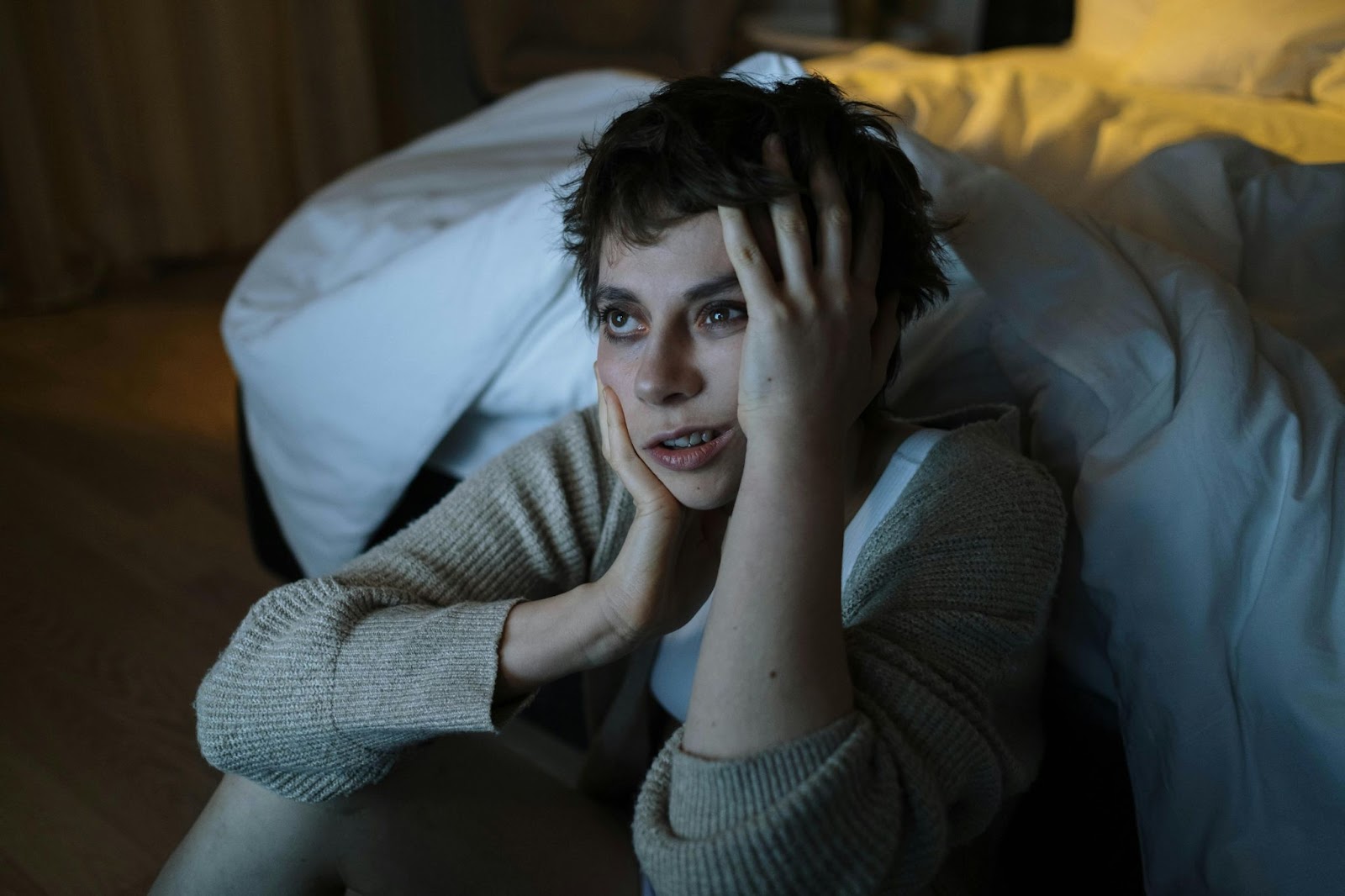 A woman looking sleep deprived. Insomnia can be one of the effects of trauma.