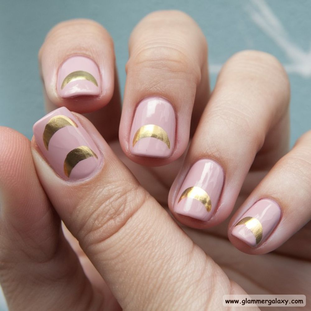 Neutral Nails having Golden Half Moons on Nude Pink
