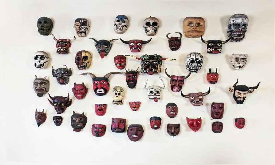 A wall with many masks