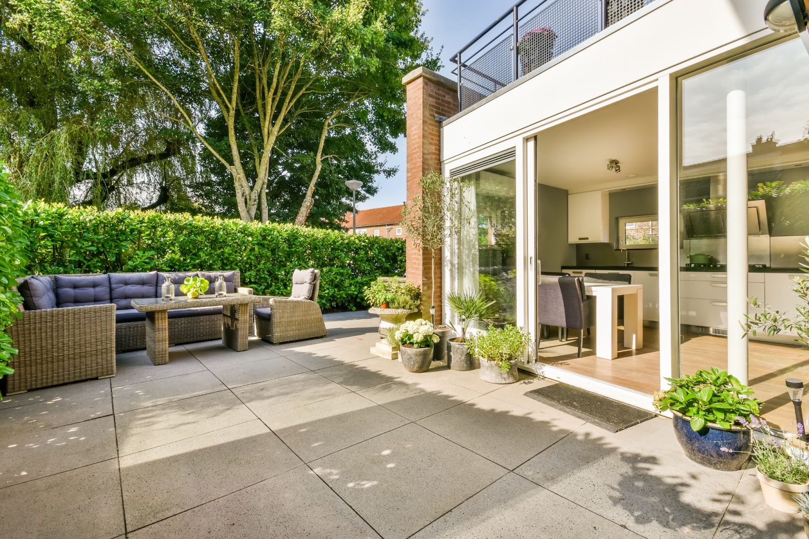 Concrete patio with outdoor furniture. 