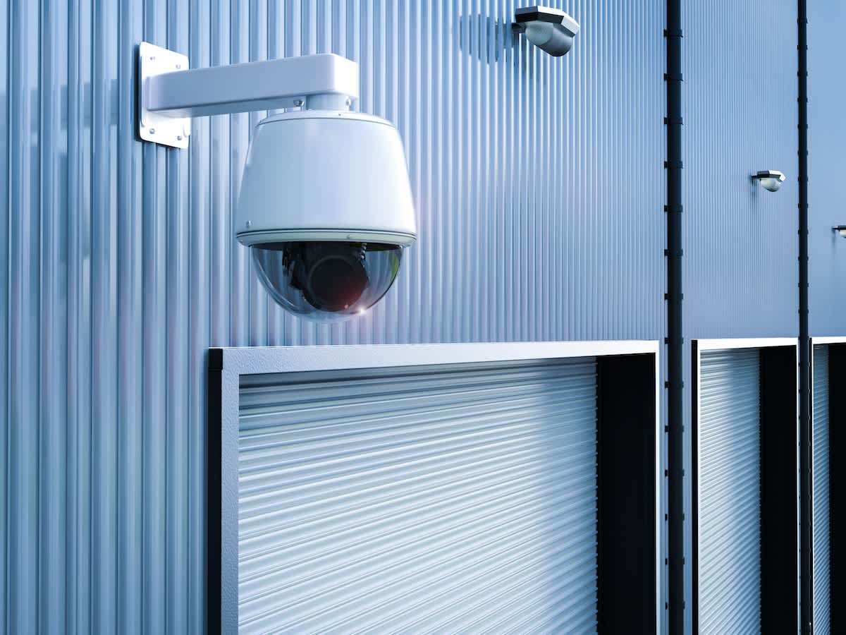 Security cameras installed on a warehouse exterior for enhanced physical protection and surveillance
