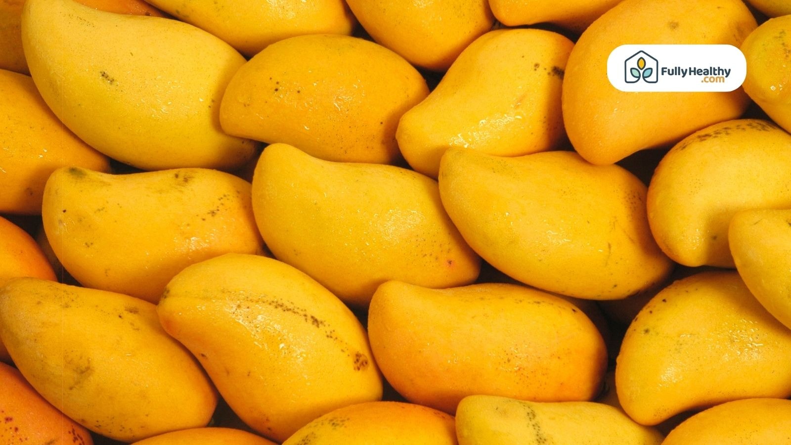 A pile of ripe yellow mangoes