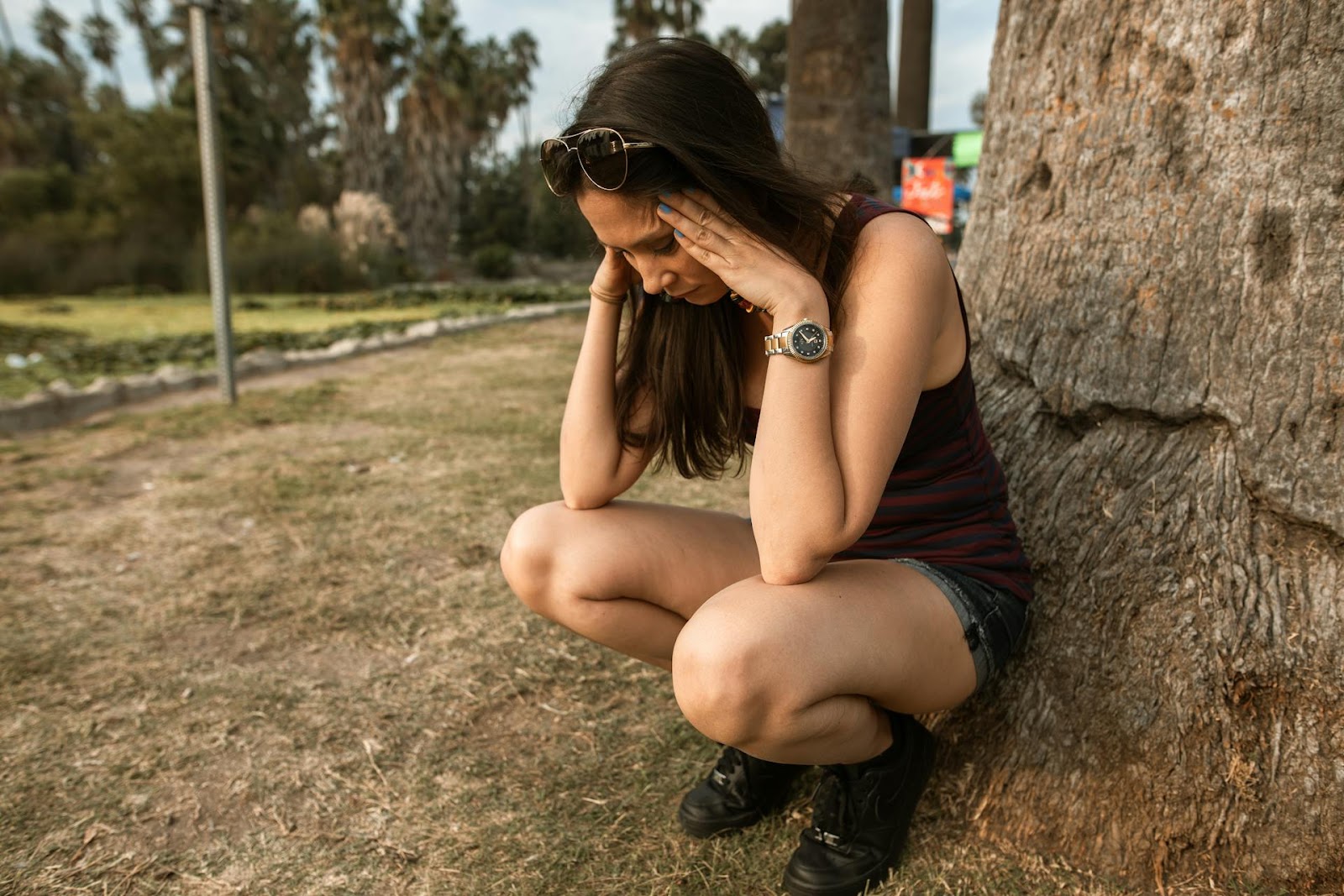 A woman outdoors worried