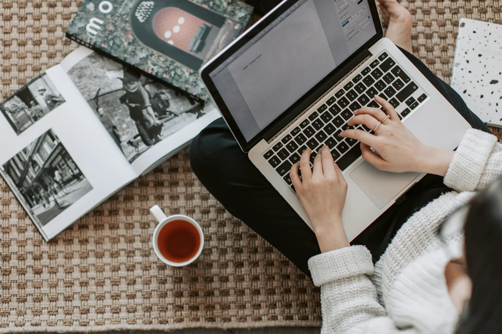 https://www.pexels.com/photo/crop-young-businesswoman-using-laptop-while-drinking-tea-at-home-4050347/