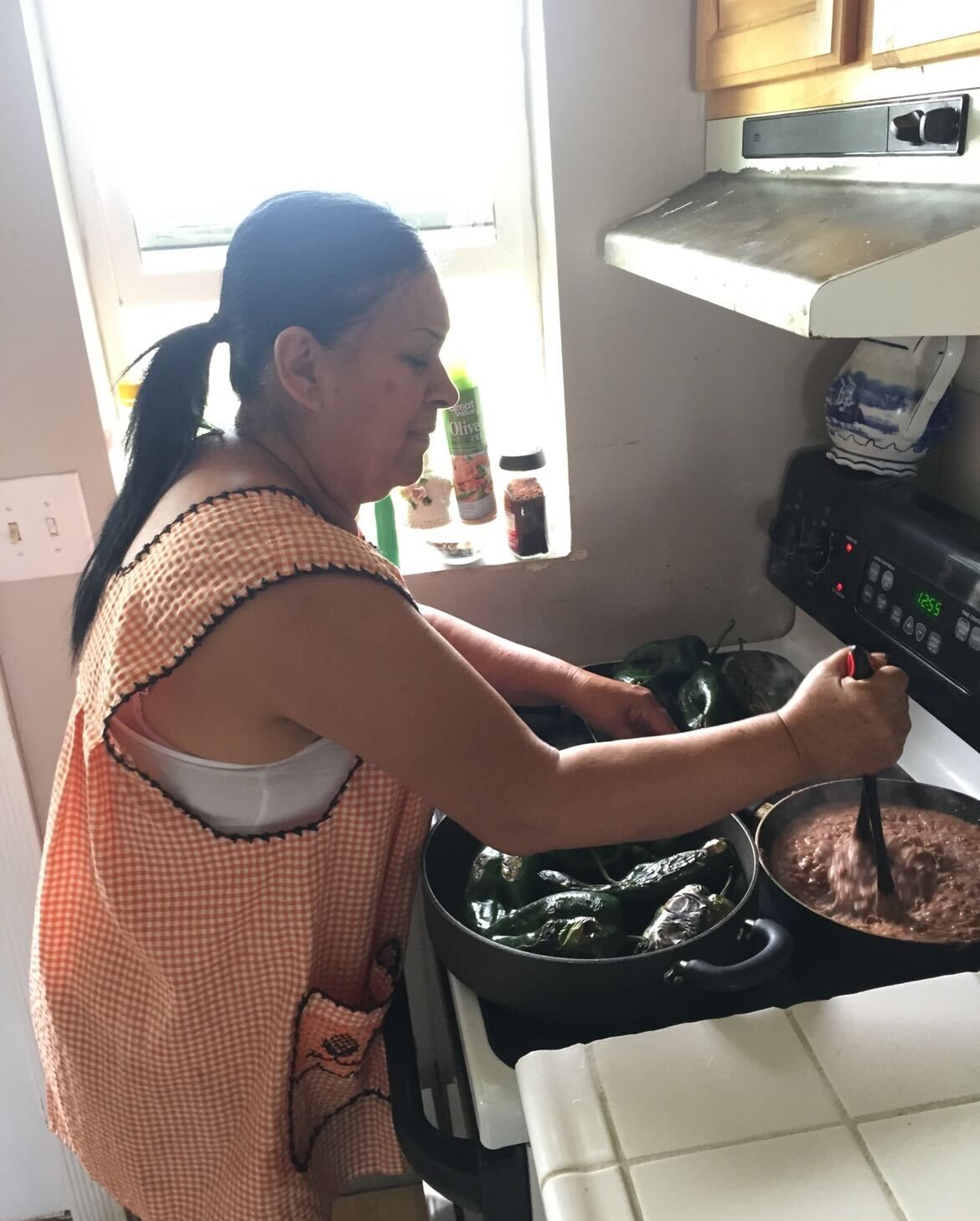 Rudy's mother cooking her traditional cuisine from her childhood.