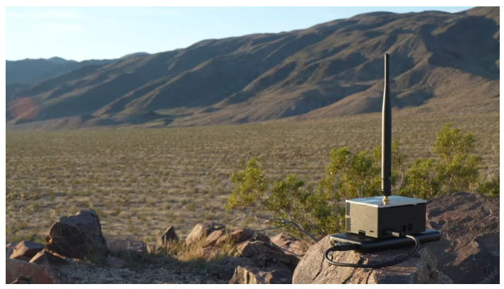 A radio antenna on a rock

Description automatically generated