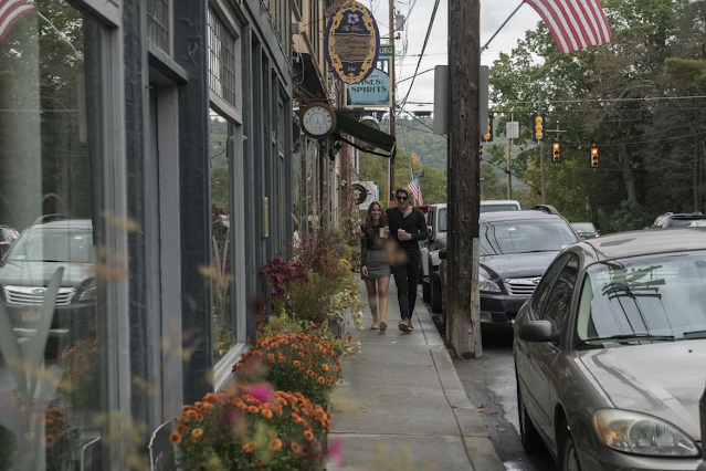 woman walking on side walk