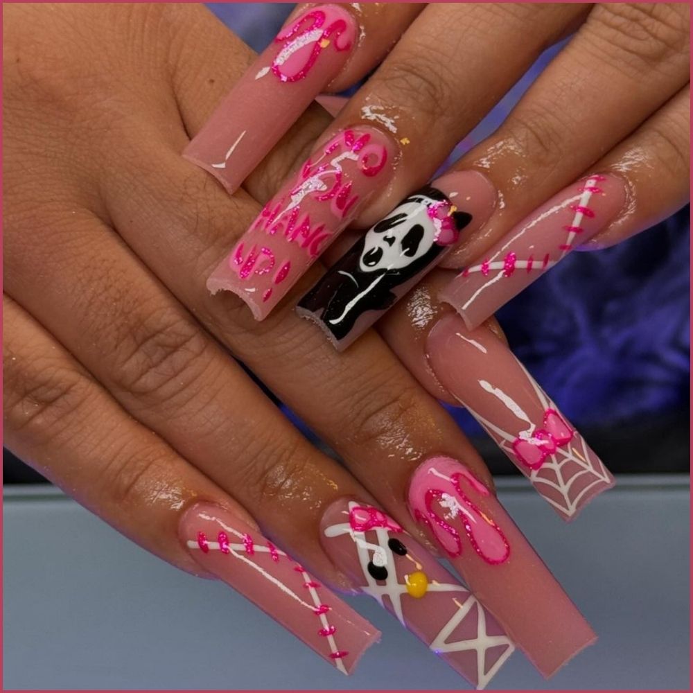 Close up of nails with spooky nails having Hello Kitty Ghostface