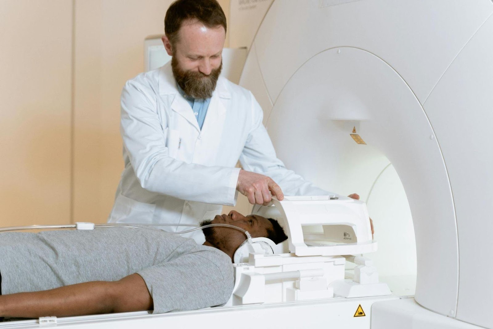 A person getting a scan of a patient

AI-generated content may be incorrect.