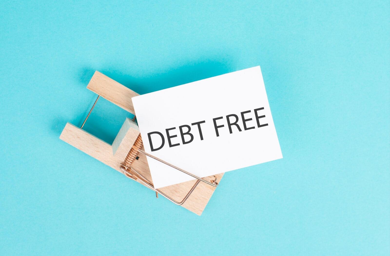 An image of a sign that says "debt free" to celebrate the benefits of a debt free status.