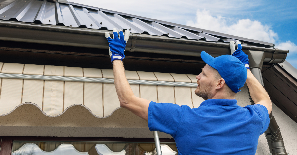 Metal roofing done by a man