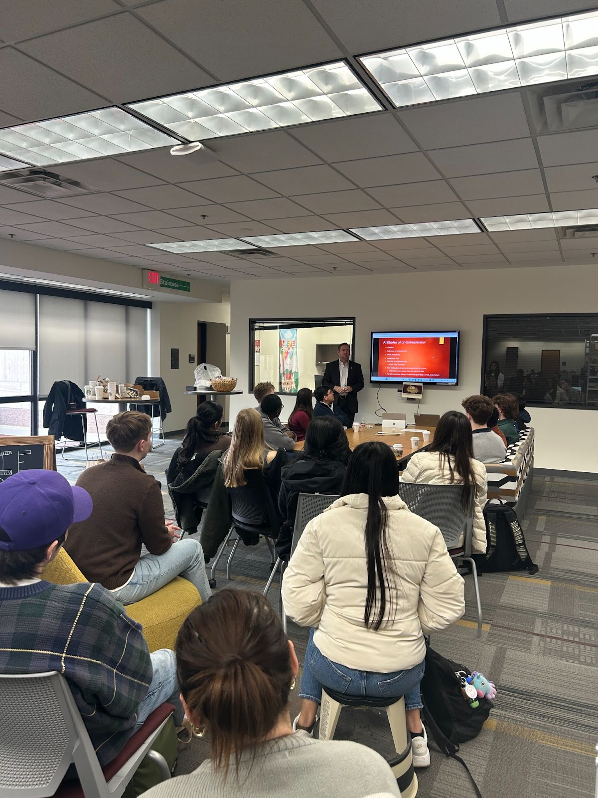 Students listening to a presentation in the Gathering Space at Alkek Library. The Gathering Space is where the Texas State CIE holds programming and events for students, faculty, and the community.
