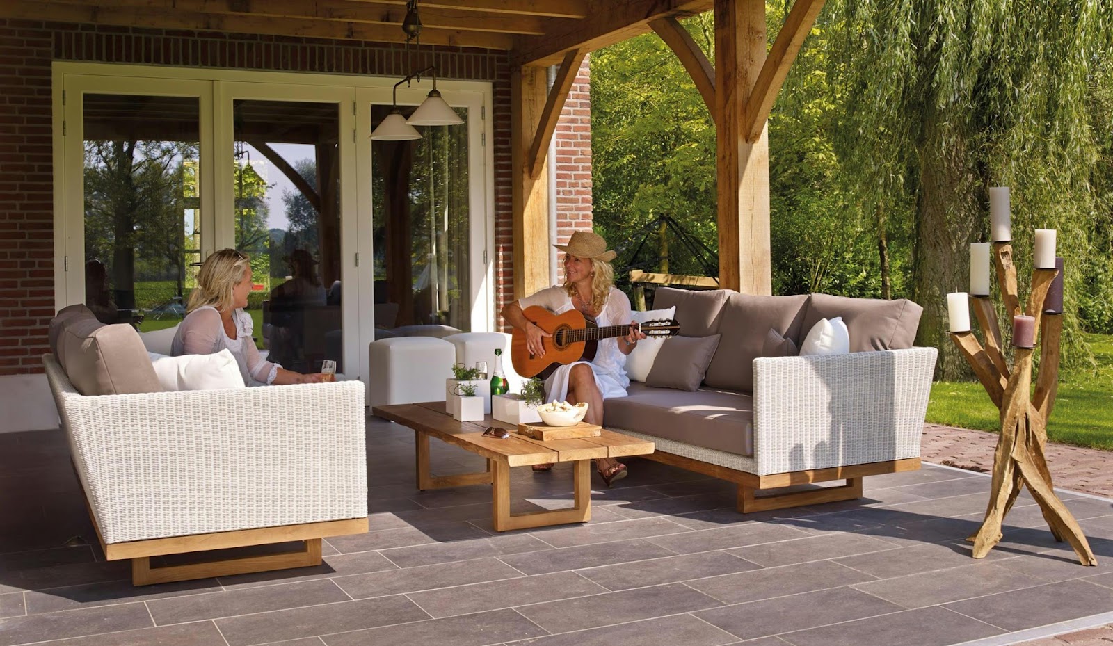 a woman playing a guitar on a couch